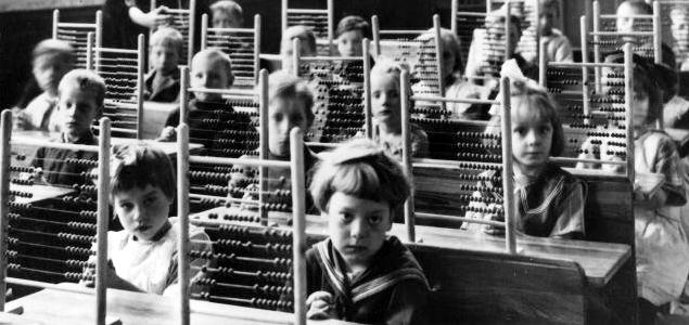 Pupils with counting-frames in classroom, about 1930.