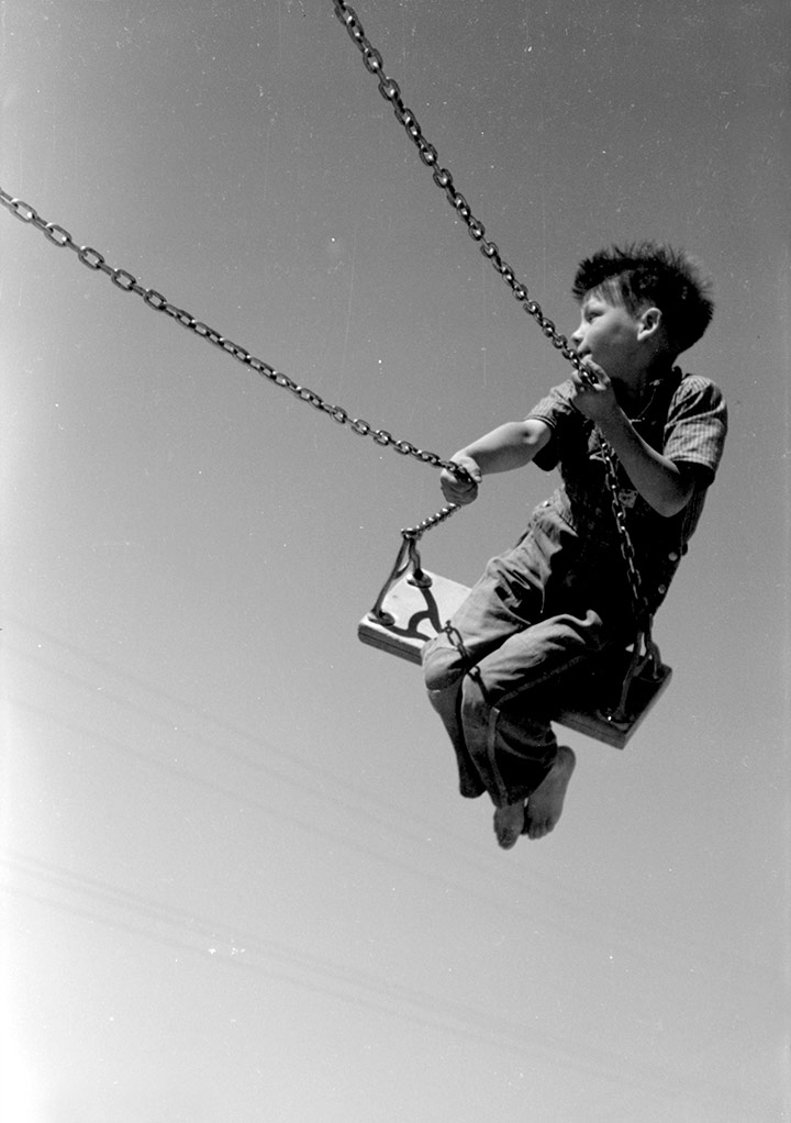 Kid on a swing. Caldwell, Idaho, 1941
