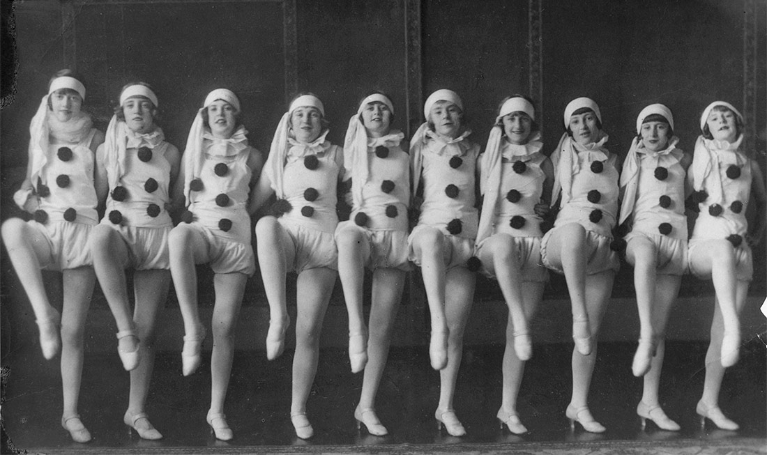 Group of dancers in clown costume performing in the original Wintergarten 'Pony Ballet'. Brisbane, Queensland, 1926