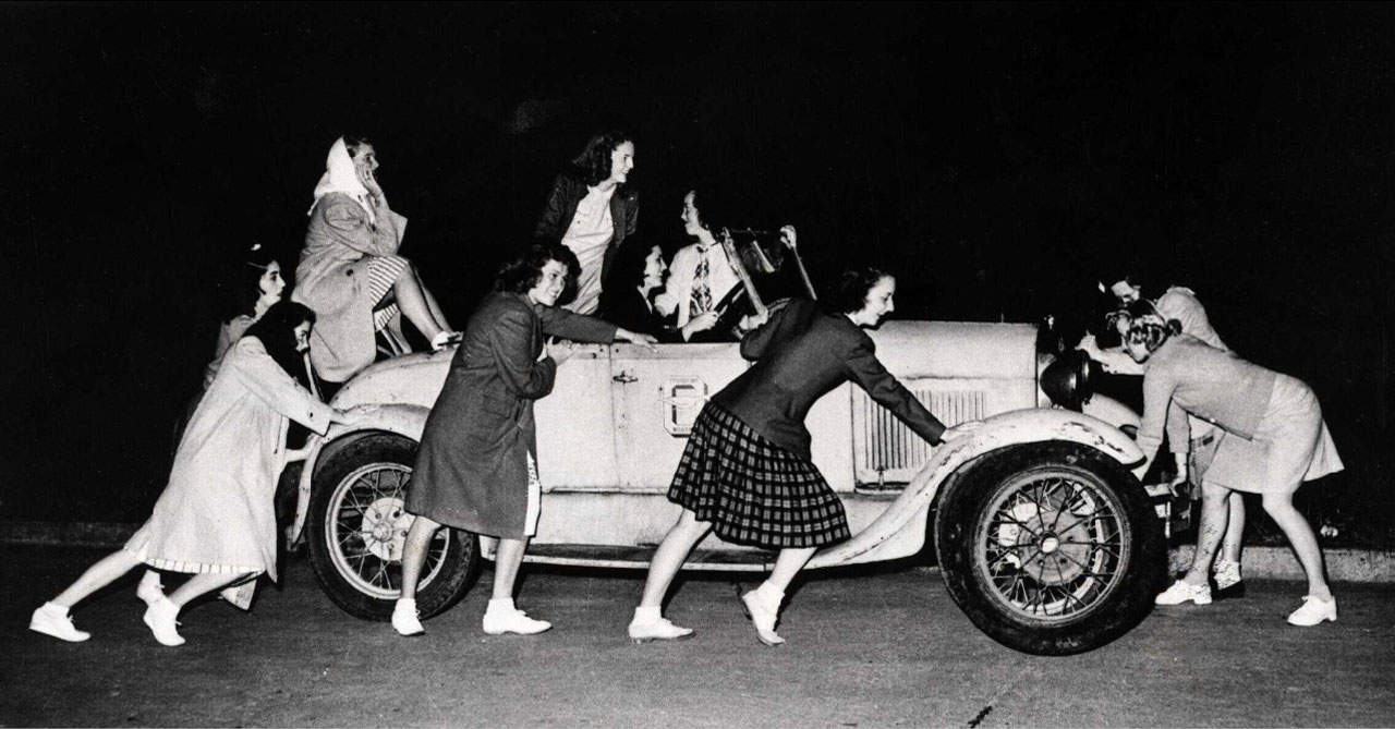 Women pushing car, 1944