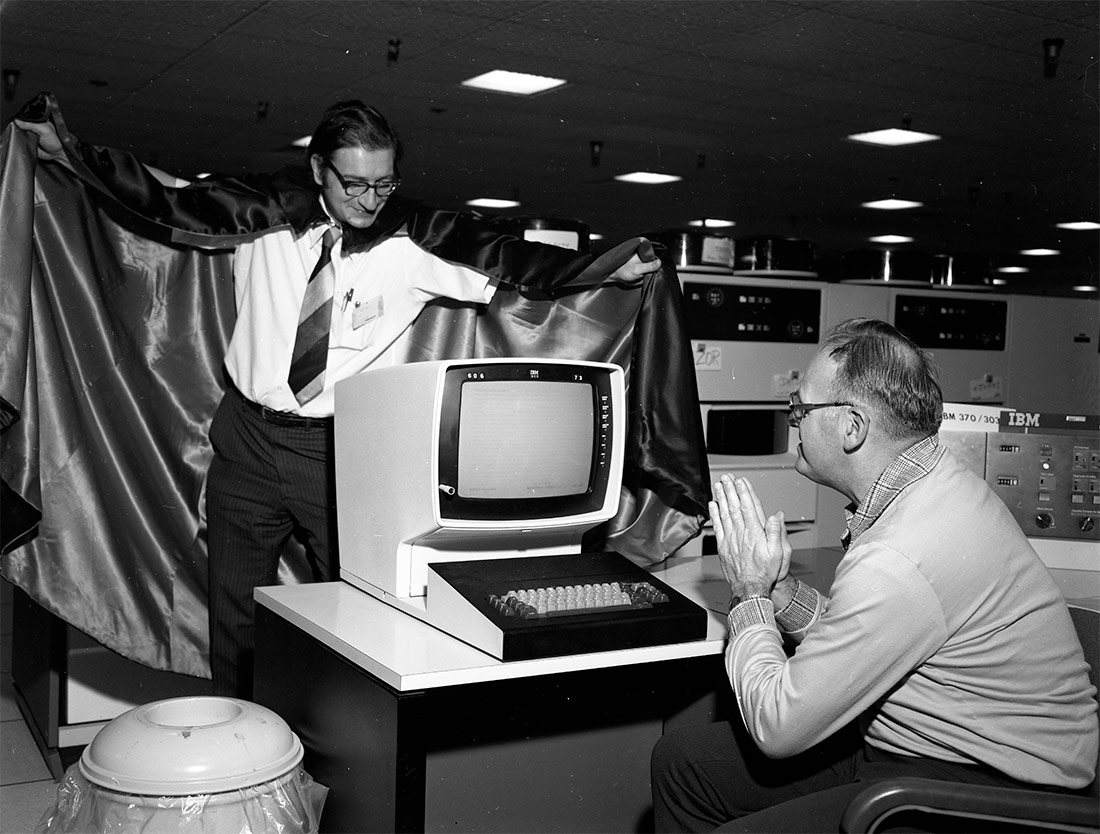 Computer with person dressed as Dracula. 1980