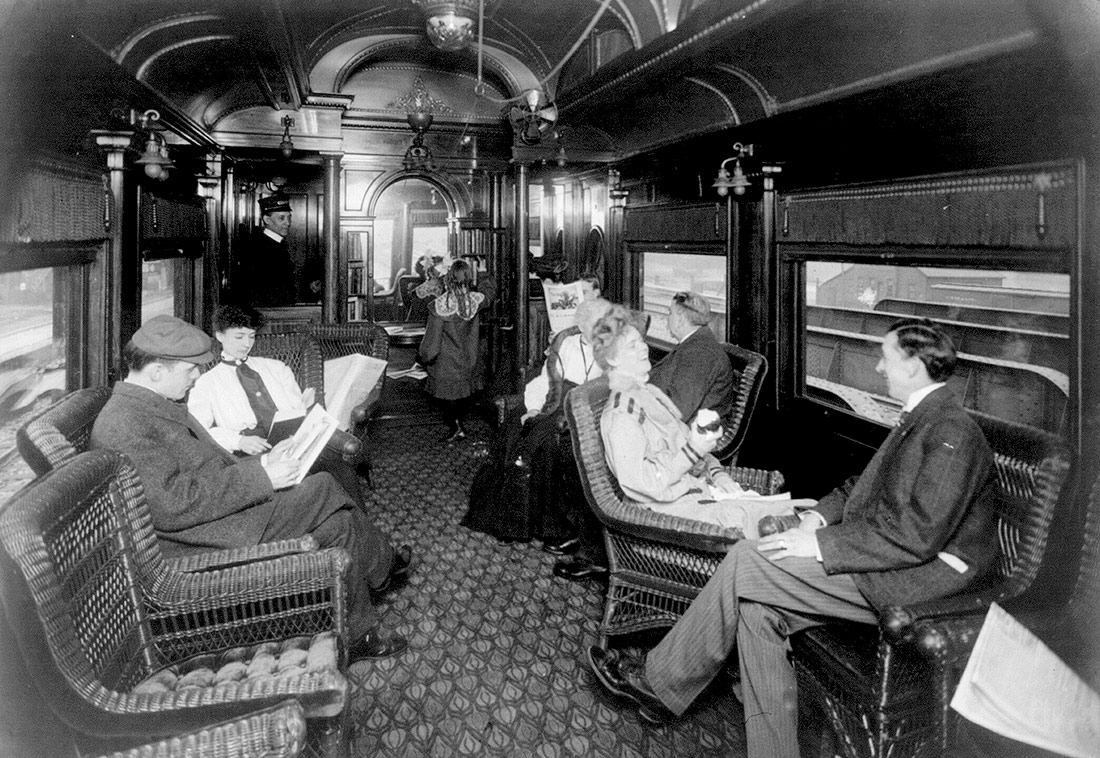Passengers either talking or reading in observation car. c 1905