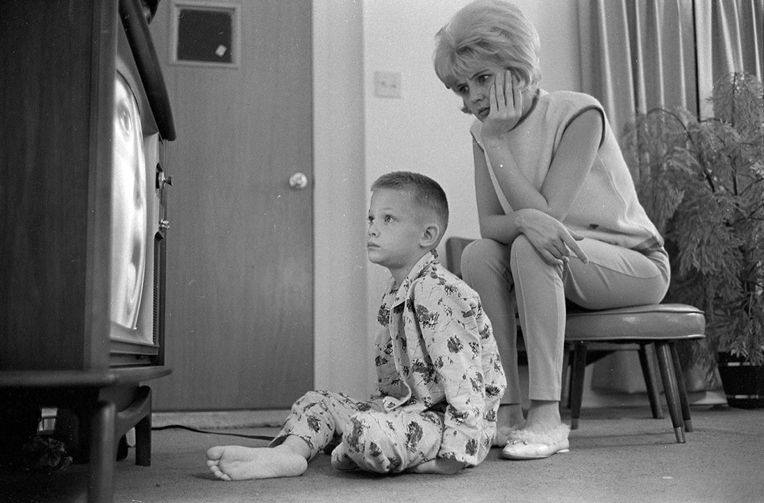 Mother with her son watching television. Saint Louis, Missouri, 1965