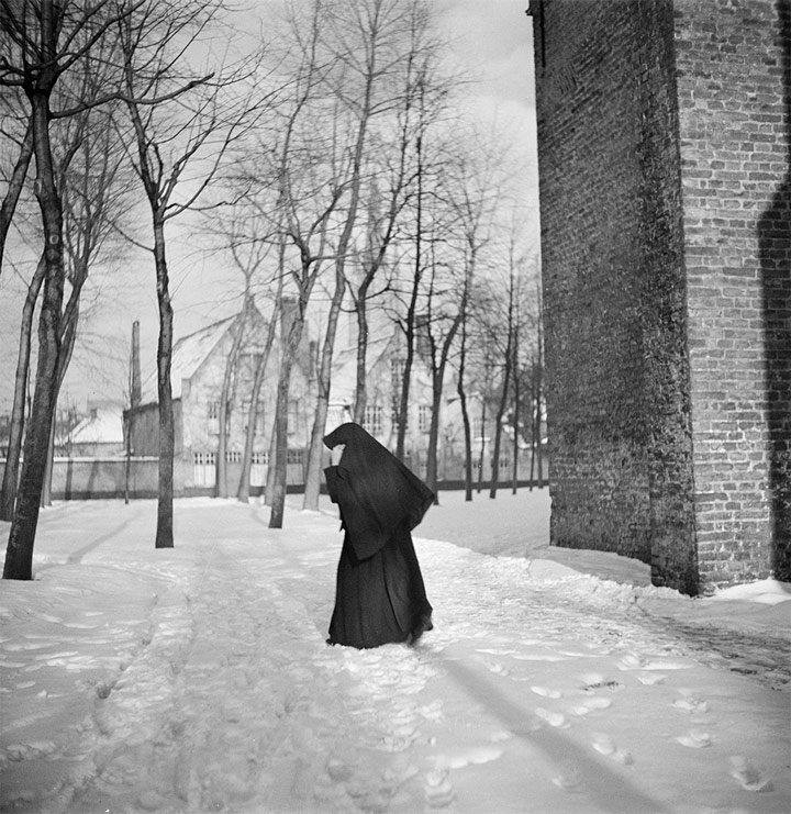 Nun walking in the snow