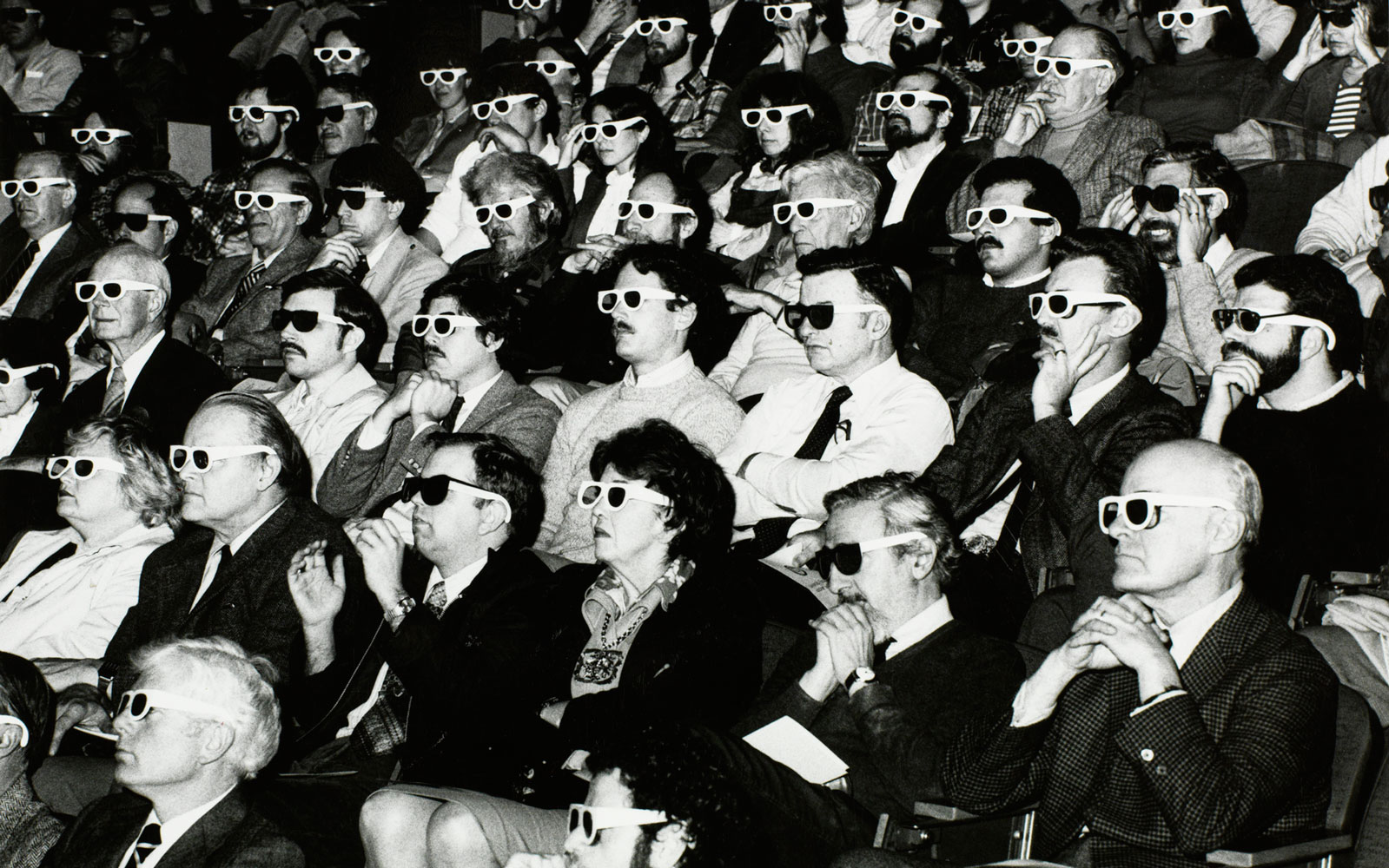 Theater audience wearing 3-d glasses, 1980-1995