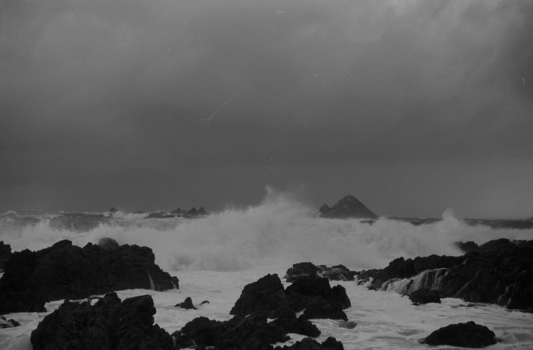 Waves breaking over rocks. Wellington, 1940